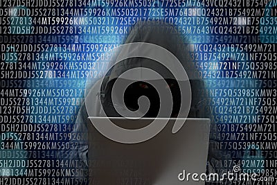 Unrecognizable hacker in front of computer â€“ cyber crime concept Stock Photo